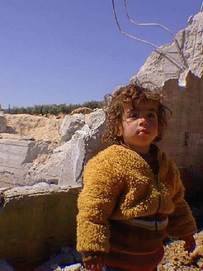 1.5 year old Wa'ad Al-Atrash in front of her newly demolished home (not related to this case)