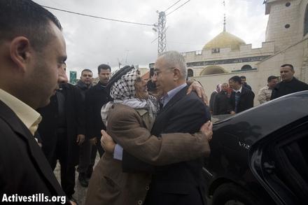 PM Fayyad greeted by village elder