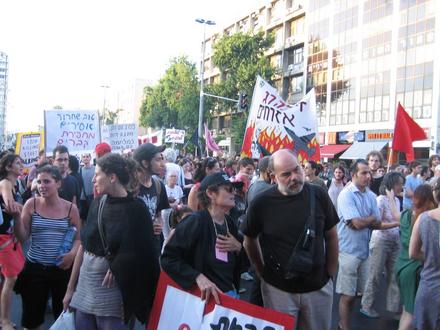 Marching through the streets of central Tel-Aviv. "Stop Killing Civilians", "Exhanging Prisoners is Better than Digging Graves"