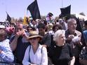 Black flags and flags of Israel/Palestine