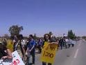 Demonstrator shouts at soldier: "Refuse, Refuse!"