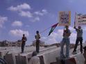 The peaceful demonstration marches along the path of the wall