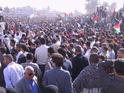 Masses press forward to the parking lot that was converted into a helicopter pad