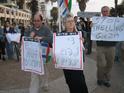 Protesters marching along the sea-shore. 