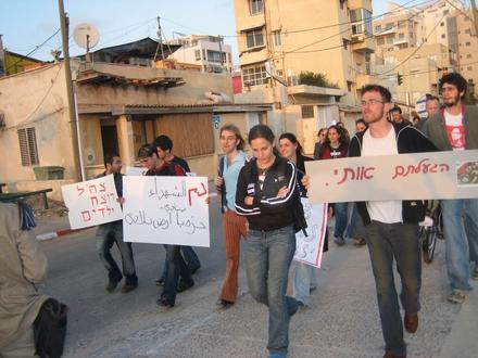 A demonstrator carrying a home-made poster: "You Disgust Me!" 