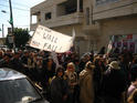 "The Wall Must Fall" - passing through the streets of Bil'in 