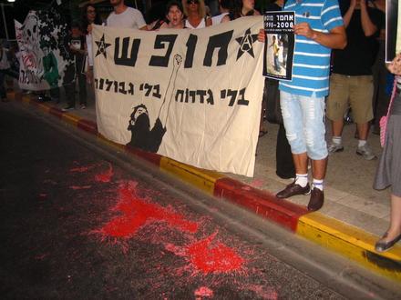 Protesters paint the street with the color of blood