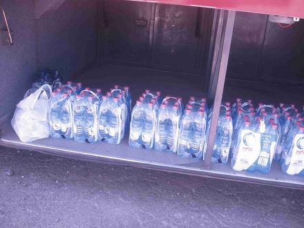 Mineral water in the bus luggage compartment