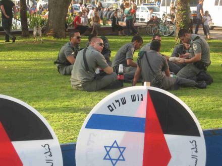 Police and Gush Shalom signs ready for action 